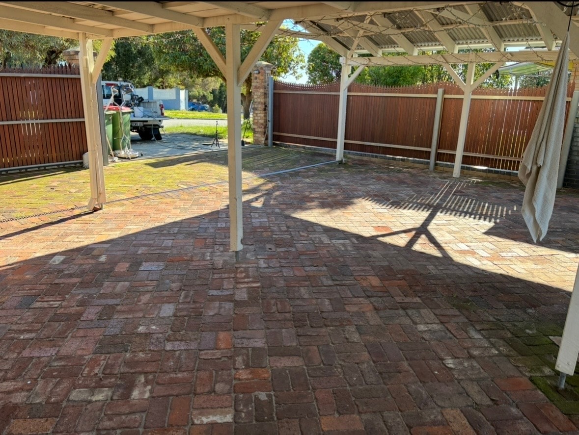 Carport paving before pressure washing